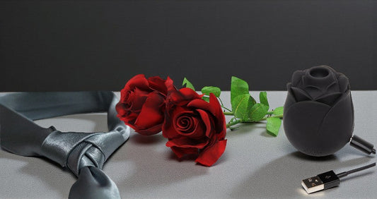 Official Fifty Shades of Grey Pleasure Collection products with Earthly Body lubricants and silk tie on a luxury setting.