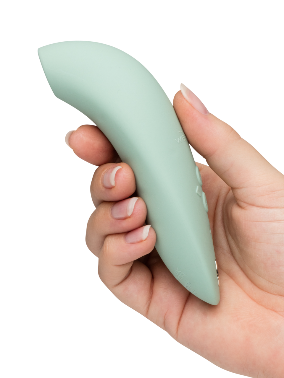 We-Vibe Melt 2 - Mint green Hand holding a light green silicone wrist rest on a white background