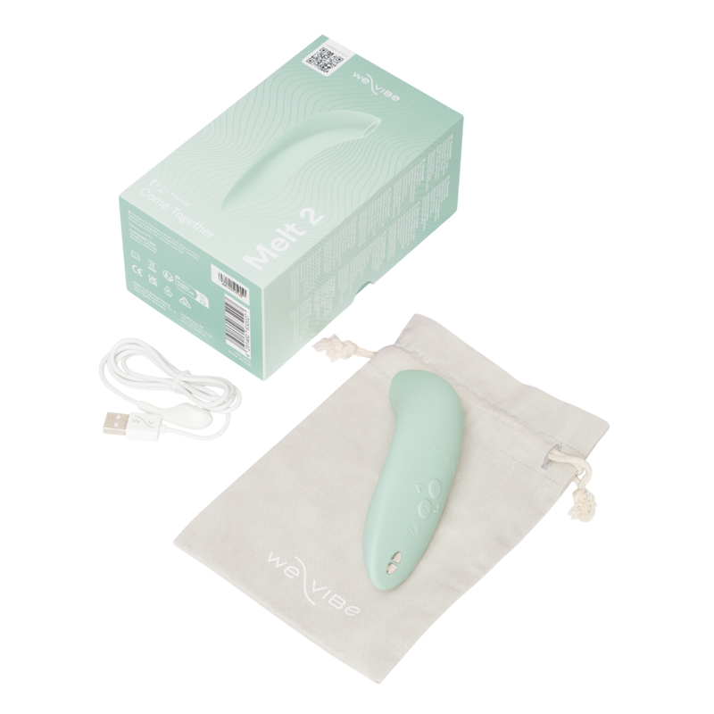 We-Vibe Melt 2 - Mint green electronic device with packaging, USB cable, and drawstring bag on a white background