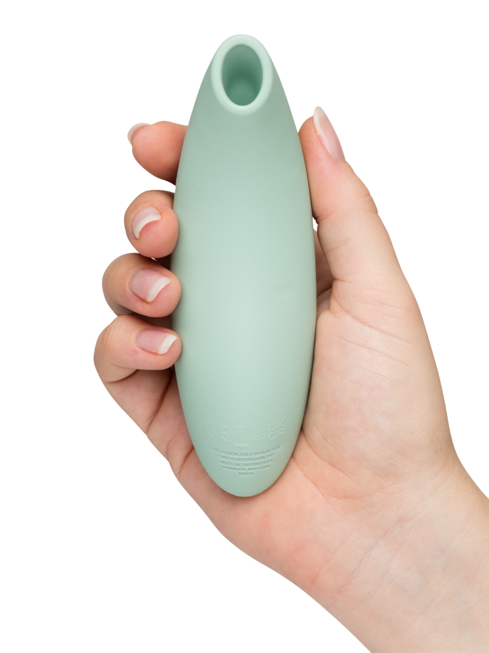 We-Vibe Melt 2 - Mint green Hand holding a light green silicone tool against a white background