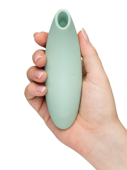 We-Vibe Melt 2 - Mint green Hand holding a light green silicone tool against a white background