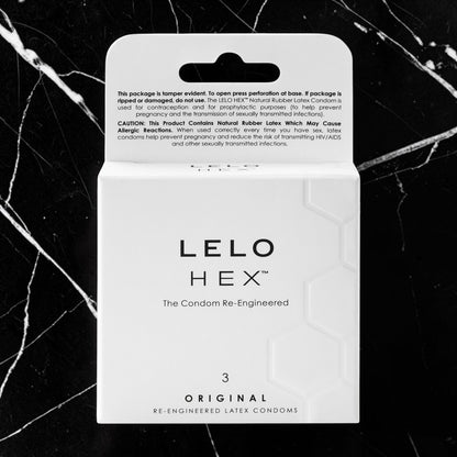 LELO HEX Original Re-Engineered Latex Condoms packaging box, containing 3 condoms, shown on a black marble background.