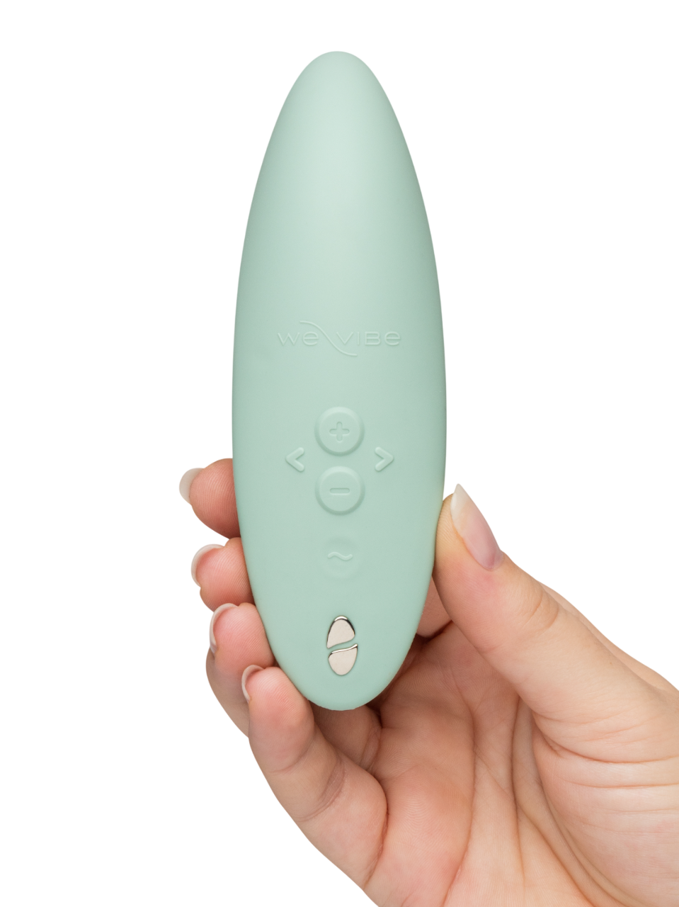 We-Vibe Melt 2 - Mint green remote control held in a hand against a white background