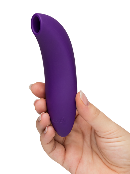 We-Vibe Melt 2 - purple Hand holding a purple silicone sheath on a white background