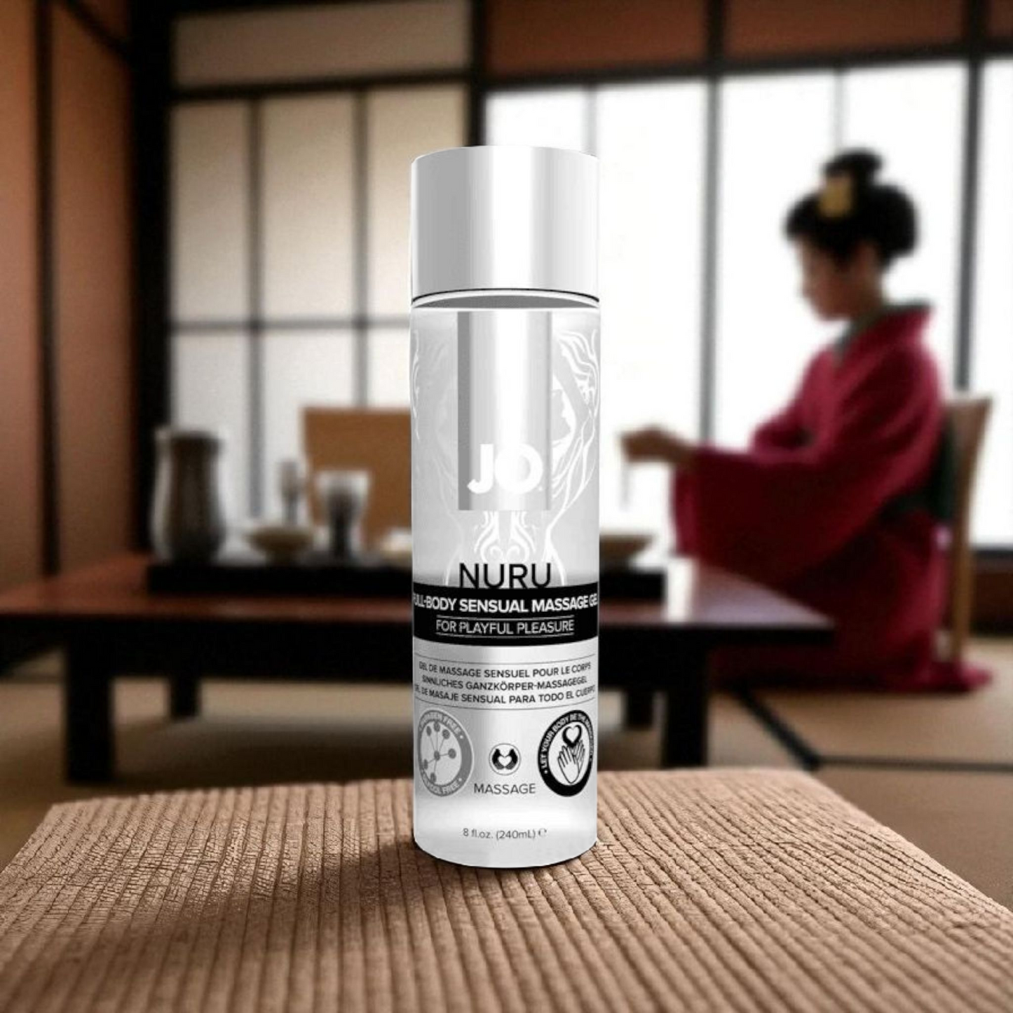 Nuru product bottle on a table with a blurred background of a person in traditional attire. - PlayLoveToys